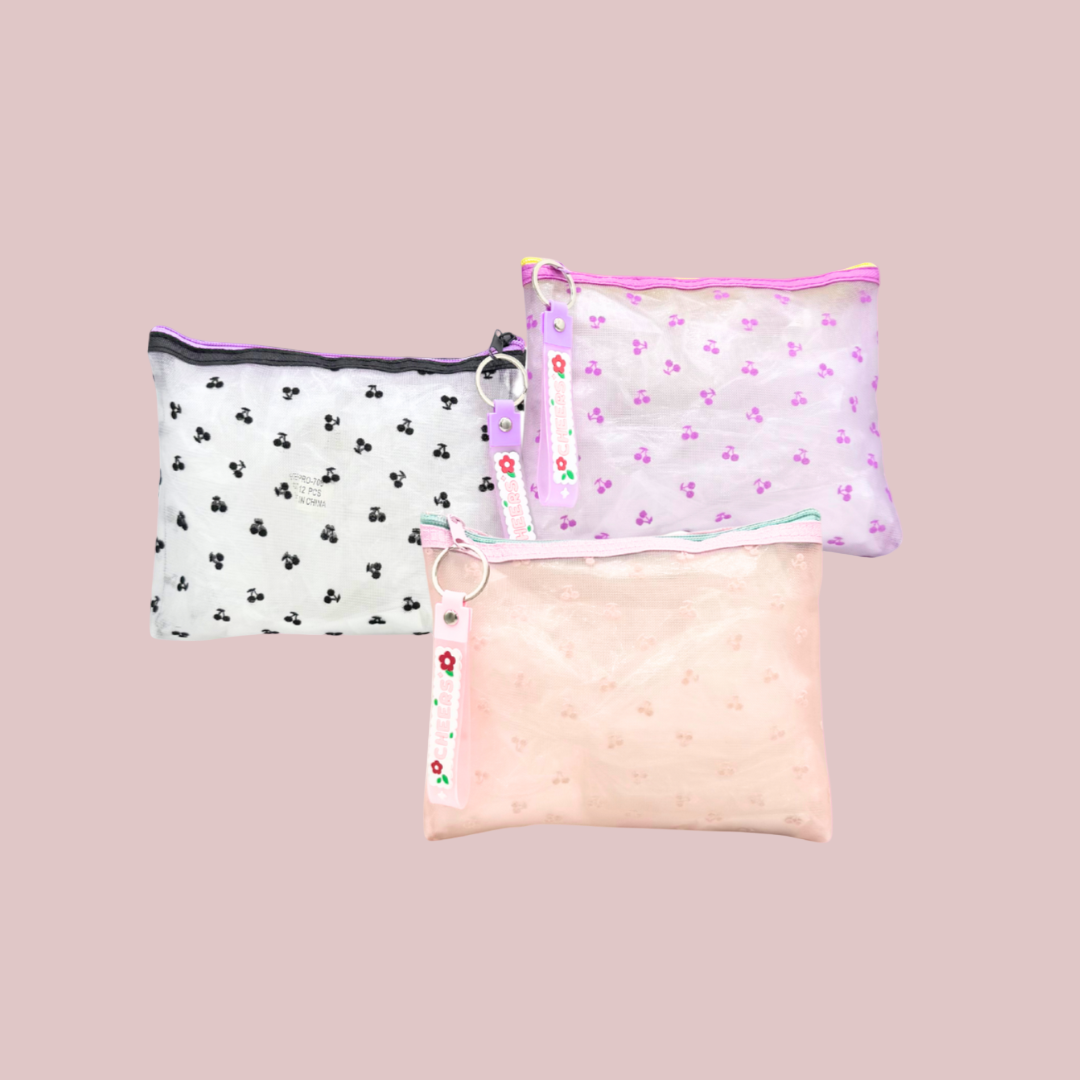 Three patterned pillows on a pink background